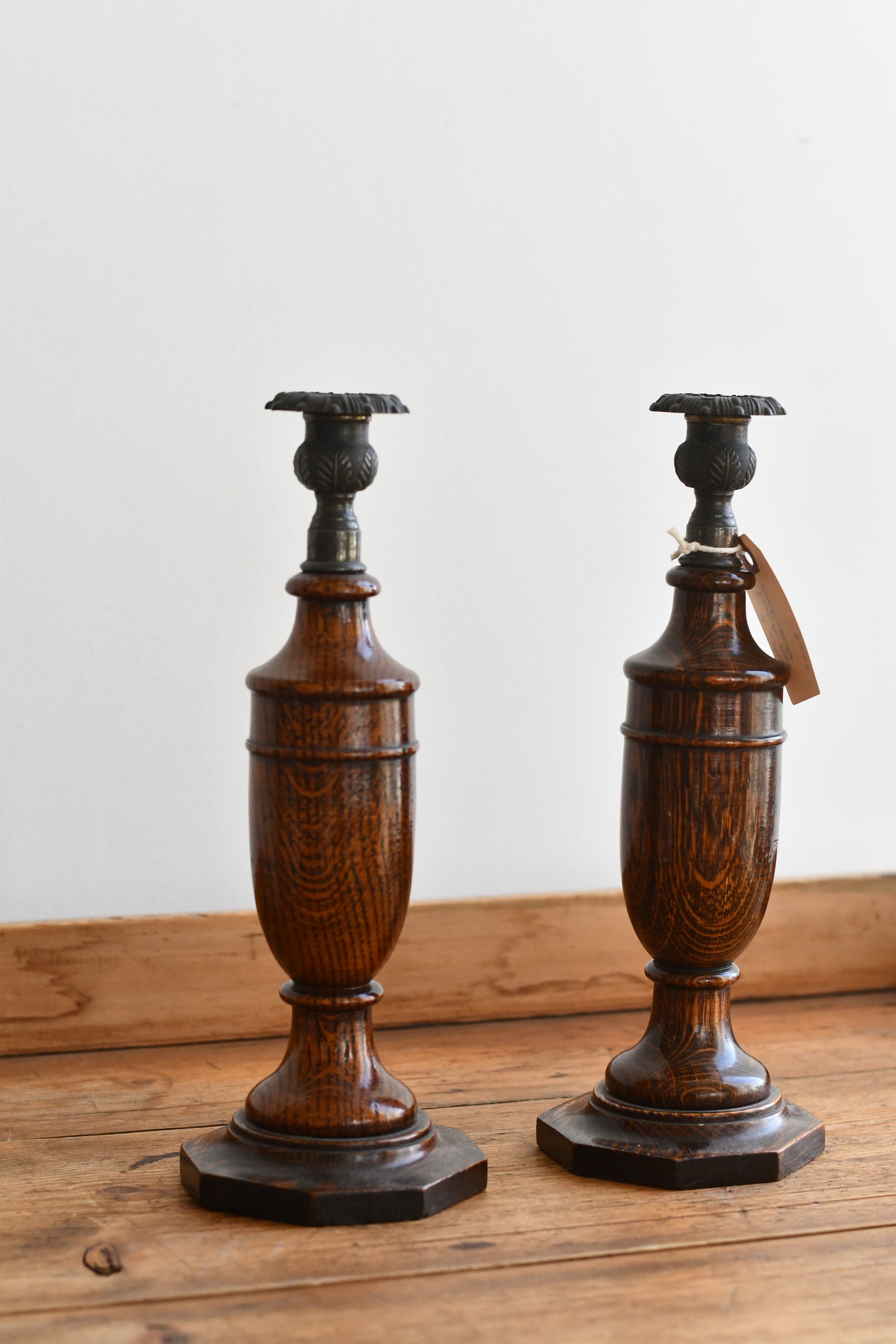 Pair of antique English oak candlesticks