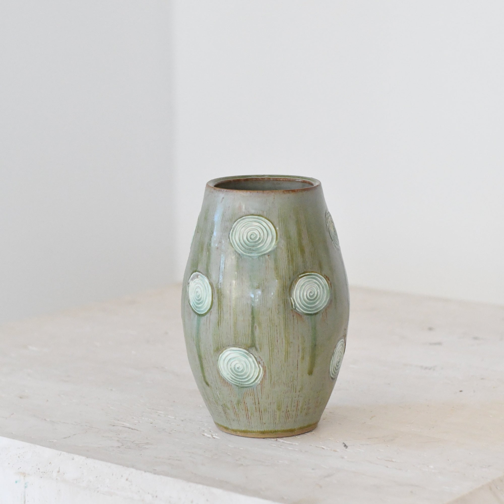 Glazed Green Pottery With Swirl Accents