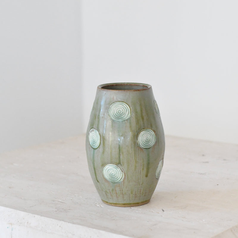 Glazed Green Pottery With Swirl Accents