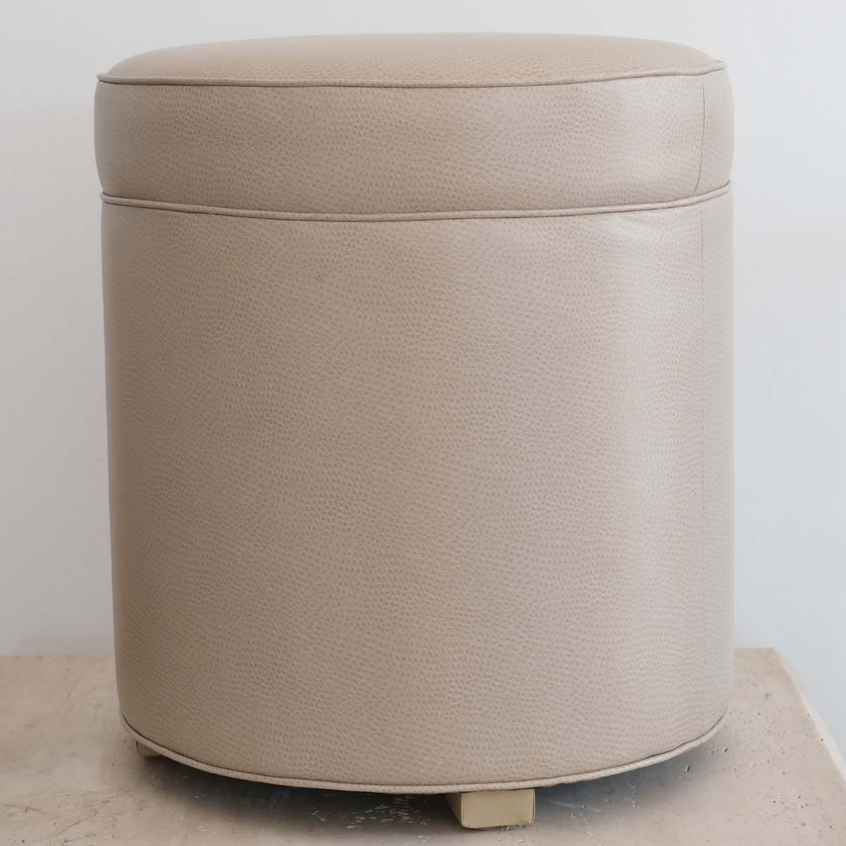 Floor sample ottoman- faux leather as is
