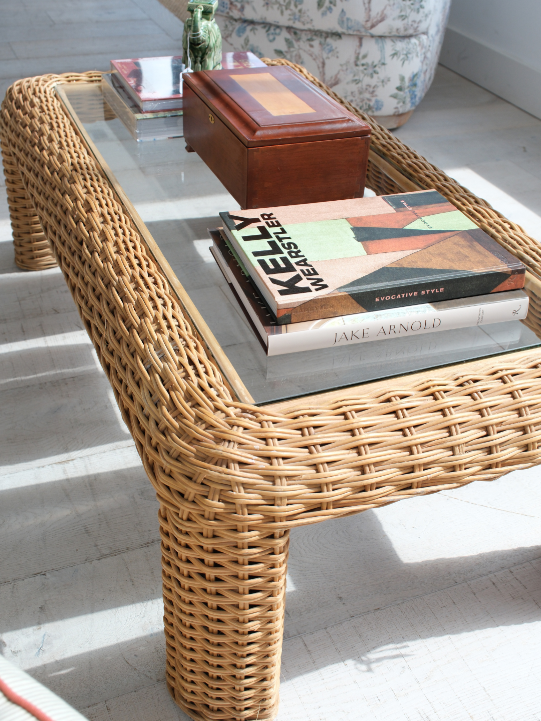 Vintage rectangular coffee table in thick hand-woven natural rattan with an inset glass top, chunky rounded legs and a softly curved wrapped frame, 50 inches wide, 28 inches deep and 17 inches high, suited to coastal, organic modern or eclectic living rooms